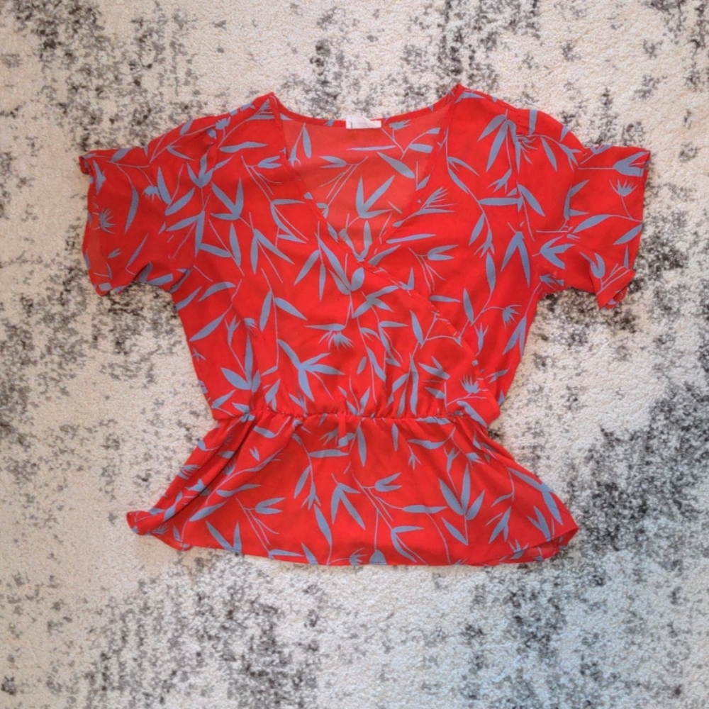 Wrap style blouse with ruffles